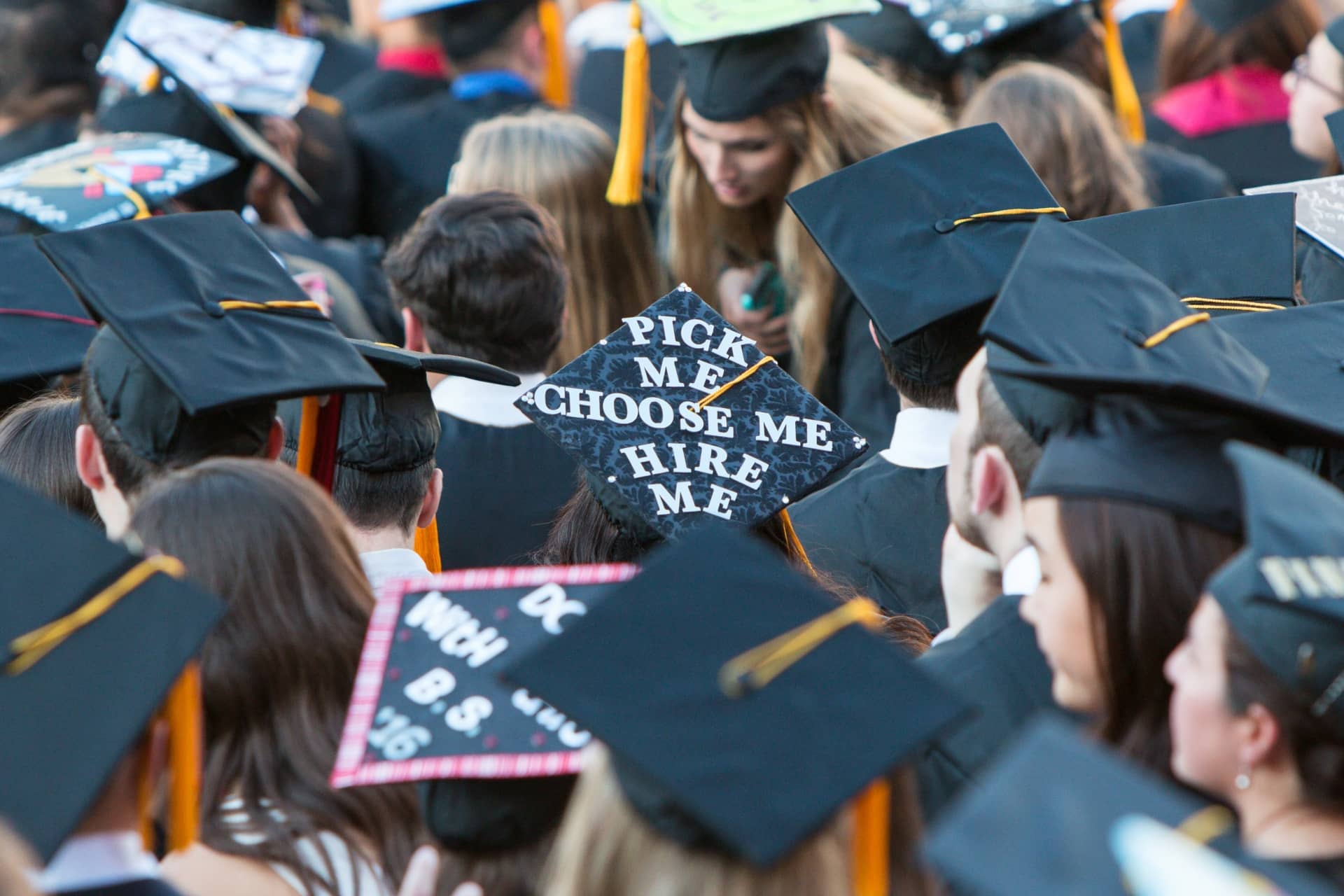College Graduate Wears Mortar Board With Message To Potential Employers