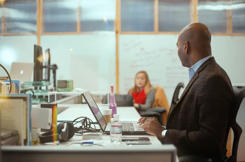 White collar worker in a suit at his desk