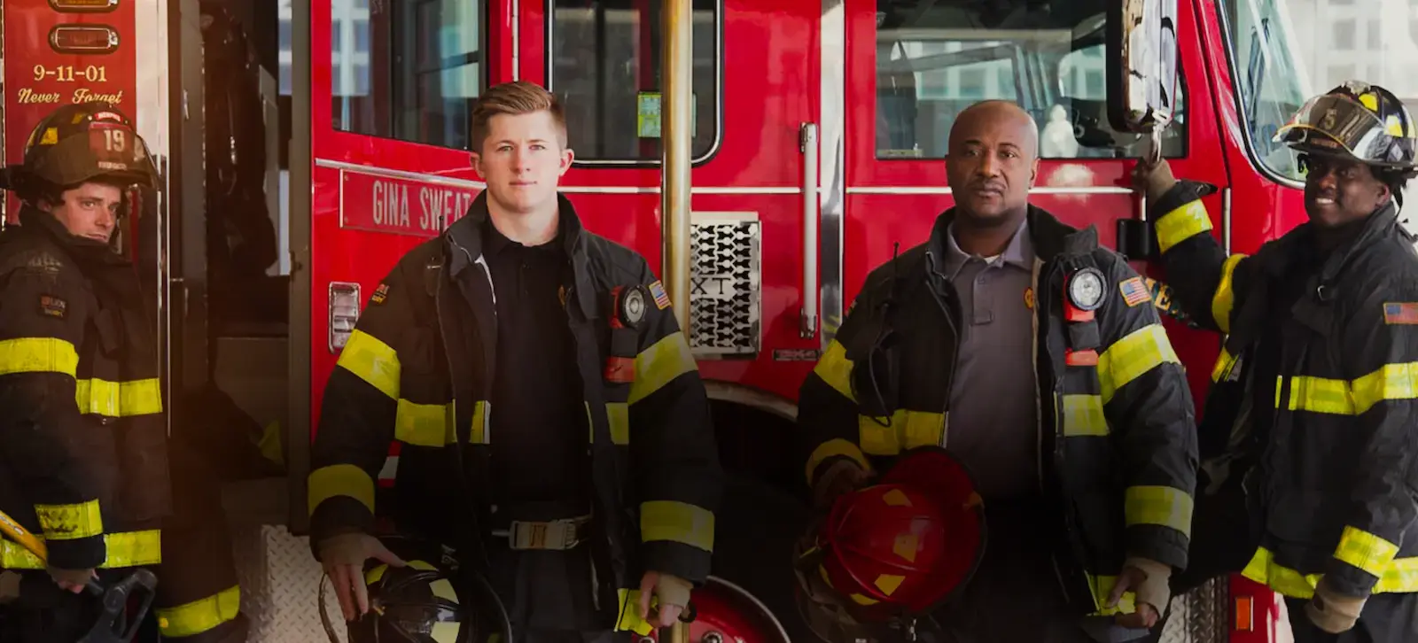 Memphis firefighters standing in front of their fire engine