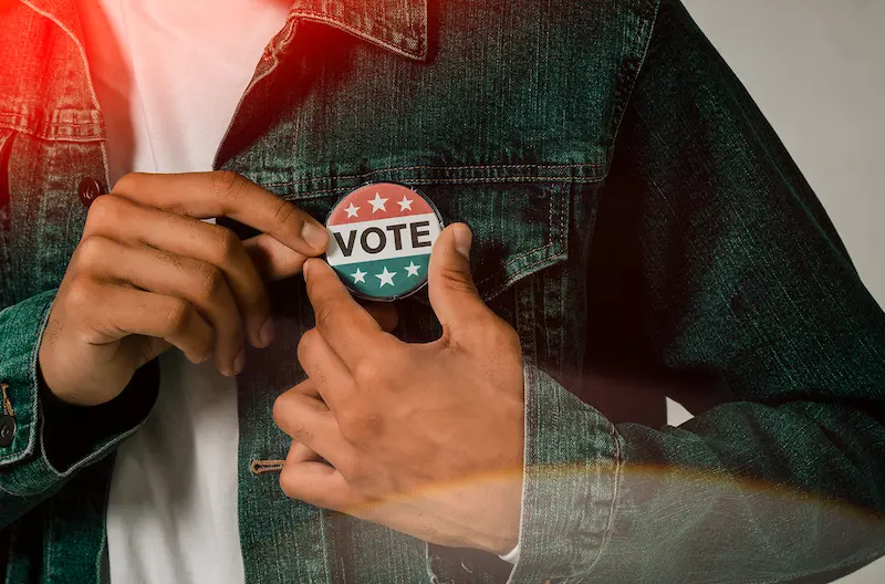 Vote button on a jean jacket